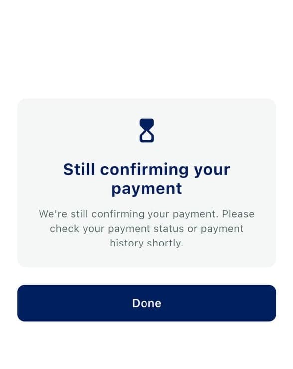 Full-screen 3-D Secure timeout sheet reading Still confirming your payment, with guidance to check payment status shortly, above a Done button