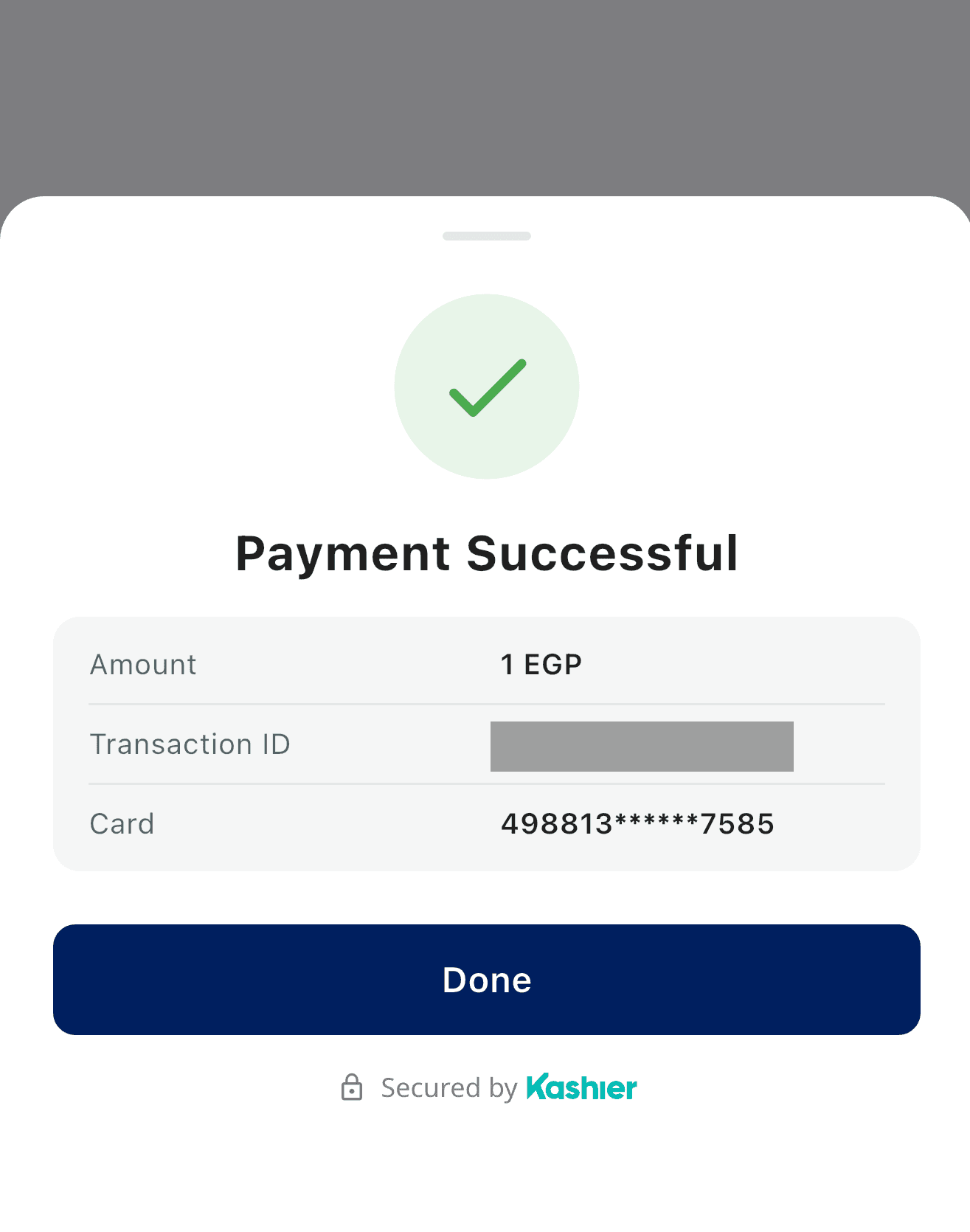 Payment Successful sheet with a green check icon and a summary listing Amount, Transaction ID and the masked card number, above a Done button